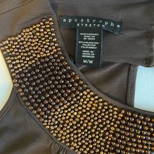 Sleeveless bead trim stretch knit top with band bottom.